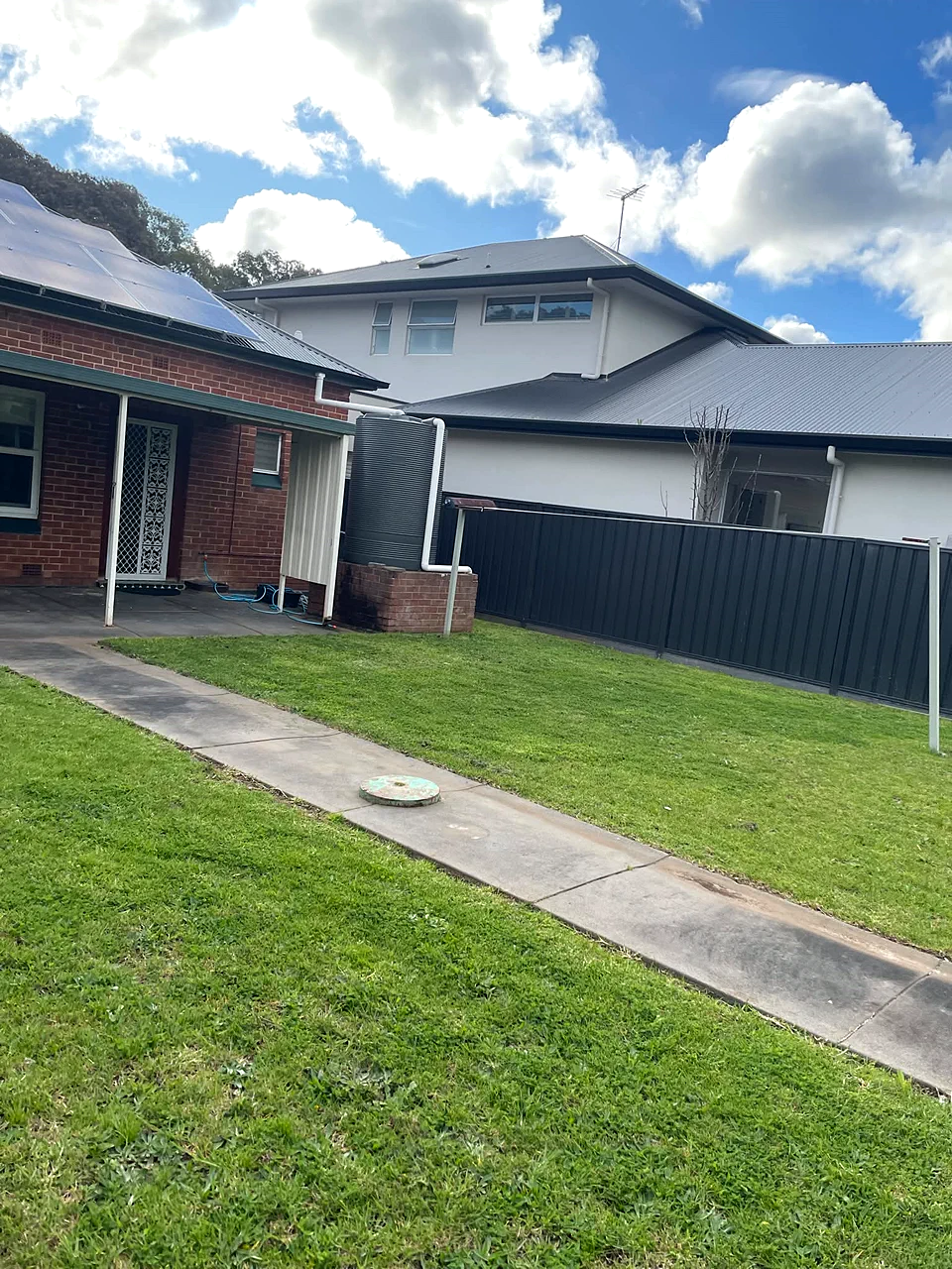 Tidy mowed side-yard lawn