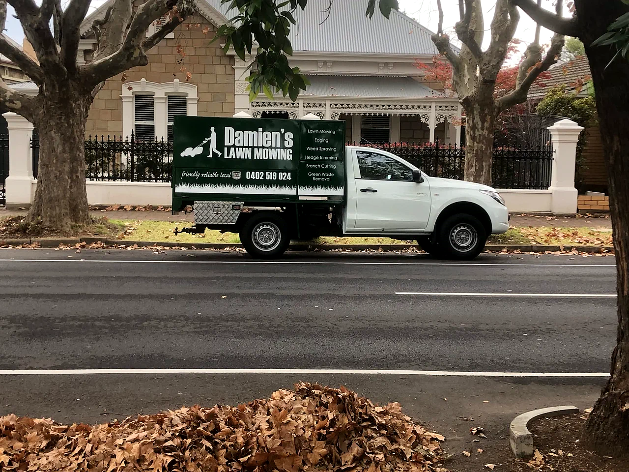 Damien's branded ute on a leafy Adelaide street